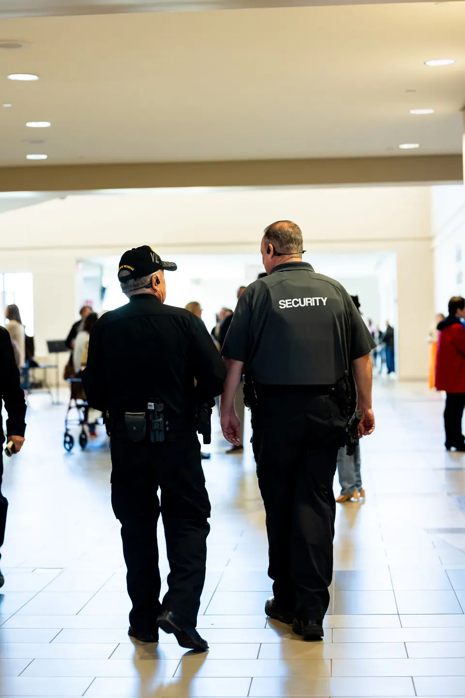 Two uniformed security officers on foot patrol