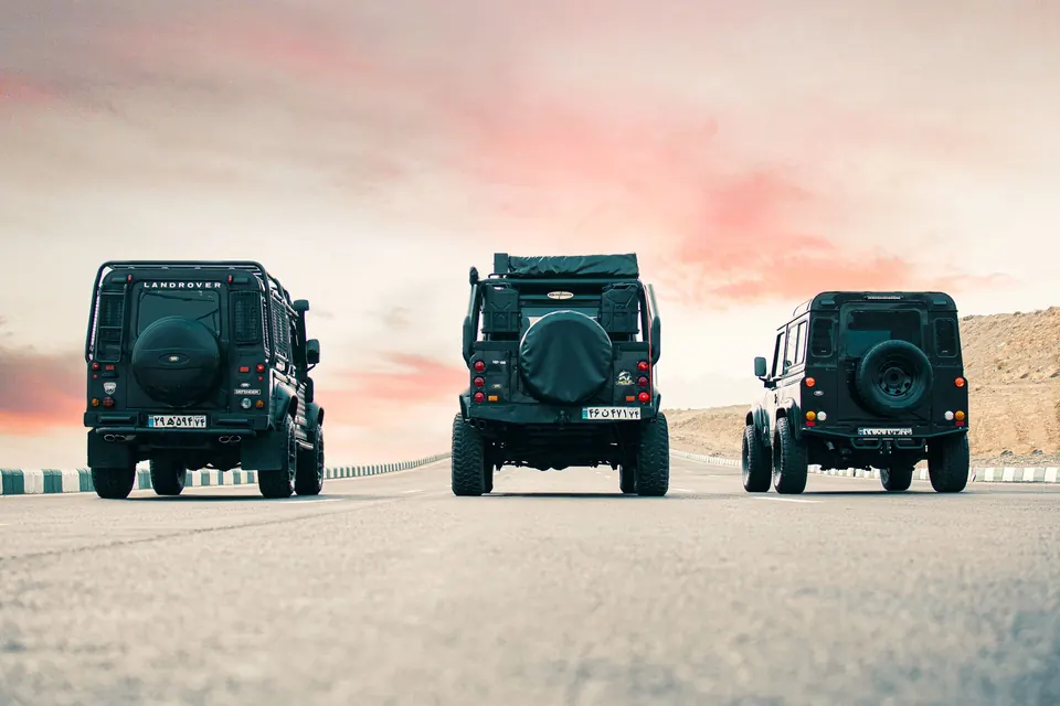 Three black SUVs staged side by side