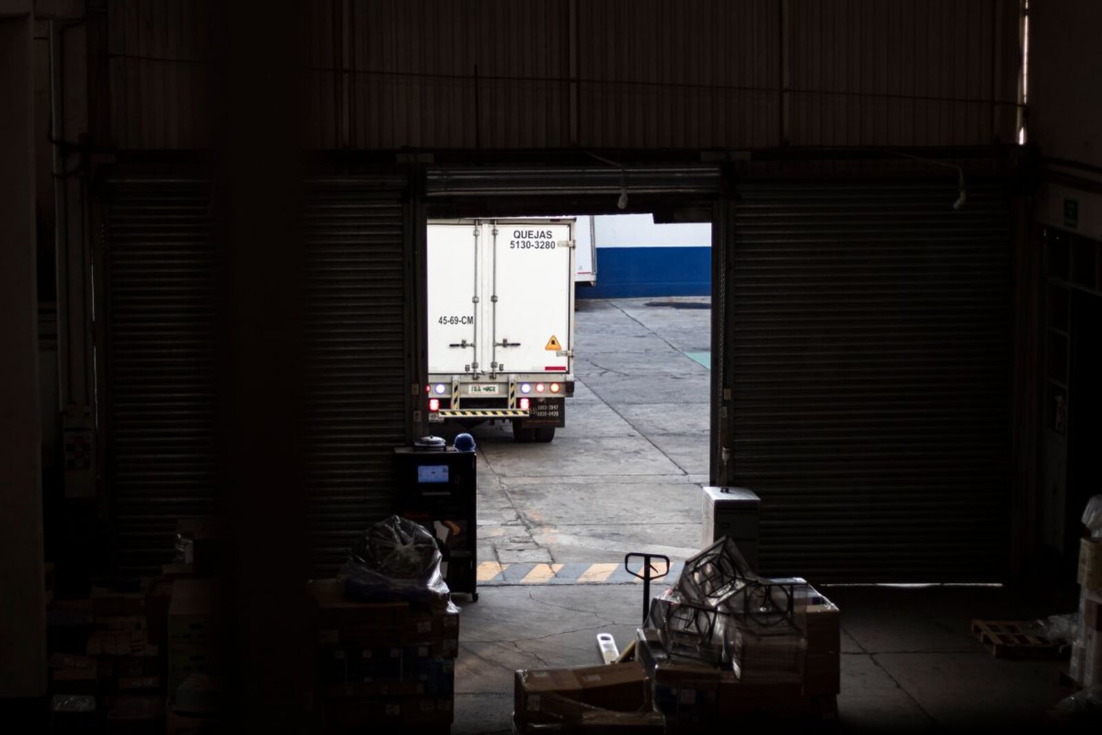 Delivery truck at a warehouse loading dock.