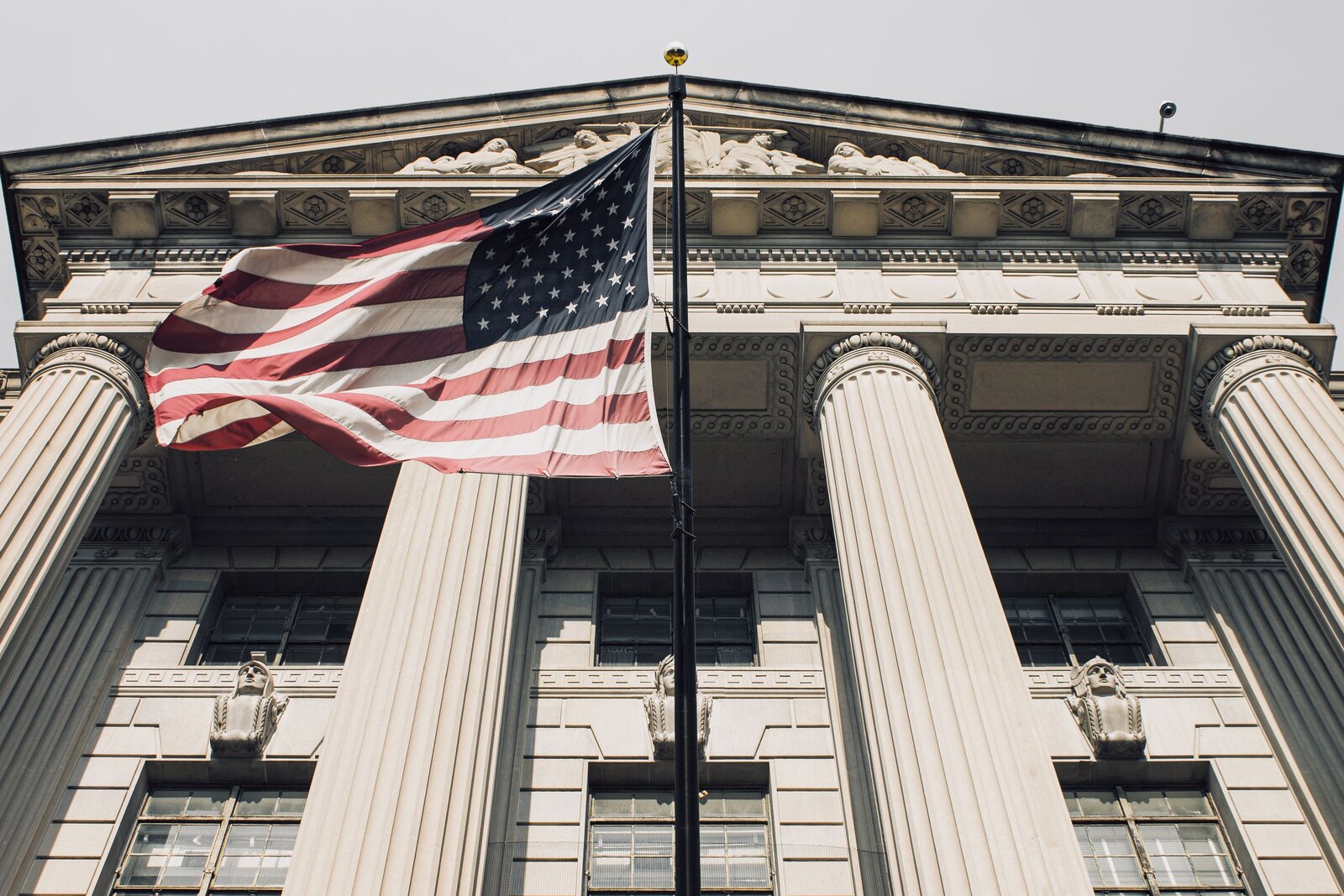American flag in front of a government building.