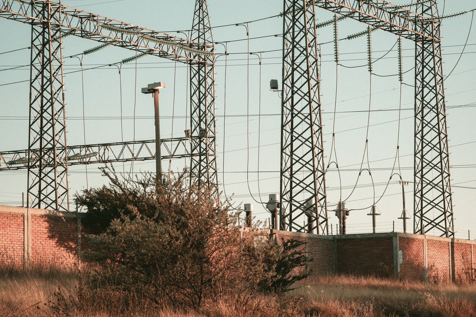 Electrical substation with transmission towers.